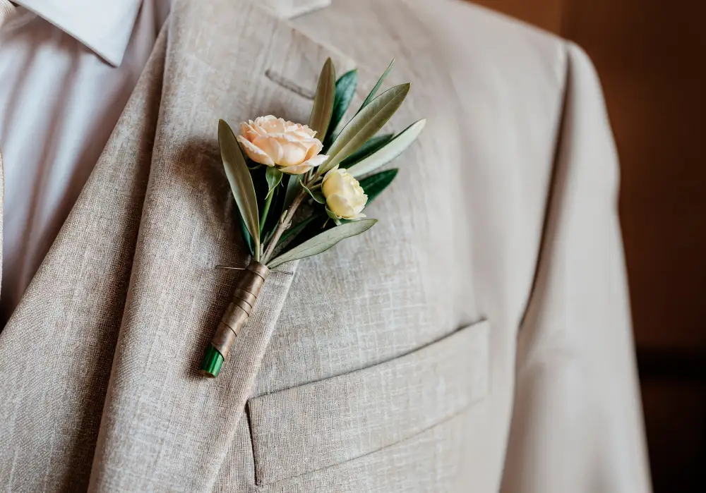Groom's boutonniere with olive branch and roses | AI-generated image